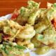 Resep Menu Ramadhan (CM) - Berikut adalah tips membuat tempura sayuran yang bisa anda hidangkan sebagai menu sahur untuk keluarga. Resep tempura sayuran ini memiliki nilai gizi yang baik untuk kesehatan, lezat dan menyehatkan karena terdiri dari aneka rasa sayur. Beberapa bahan sayur yang sering digunakan adalah bawang bombay, terung ungu, daun bayam atau jamur shittake. Cara Membuat Tempura Sayuran Bagi anda yang ingin mencoba tempura sayur makanan khas dari jepang sendiri di rumah, kami akan berbagi resep dengan anda cara membuat tempura sayuran yang lengkap dengan bumbu tepung yang gurih dan renyah. Namun sebelum kita membuat tempura sayur crispy, kita sediakan terlebih dahulu bahan-bahan diperlukan. 300 gram udang ukuran besar tanpa kulit, sisakan ekornya, belah punggungnya, pipihkan 150 gram bawang bombay, iris bulat 150 gram terung ungu, potong 2, iris tipis membujur 1 cm 150 gram daun bayam jepang 50 gram jamur shiitake, iris tipis 300 gram tepung terigu serbaguna Minyak sayur, untuk menggoreng 200 ml air es ½ sendok teh garam Setelah anda mempersiapkan bahan-bahan diatas, selanjutnya mari kita langsung coba untuk membuat tempura sayuran. Ikuti langkah-langkah berikut: Langkah pertama bersihkan udang, kupas kulitnya, kemudian bagian punggungnya dierat dan terakhir adalah beri garam, sisihkan. Kemudian campurkan tepung dengan air hingga merata, kemudian masukan telur kocok hingga rata Selanjutnya lumuri udang, terung, jamur shiitake, bawang bombay dengan menggunakan adonan tepung Lalu panaskan minyak panas dengan menggunakan wajan anti lengket Goreng adonan hingga matang, warna berubah menjadi kuning keemasan Kemudian angkat dan tiriskan Sajikan selagi hangat Proses membuat yang begitu cepat, saus tempura sayuran cocok disajikan setelah melaksanakan shalat tarawih bersama keluarga.